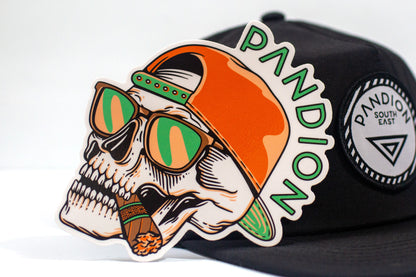 pandion skull sticker in front of black hat